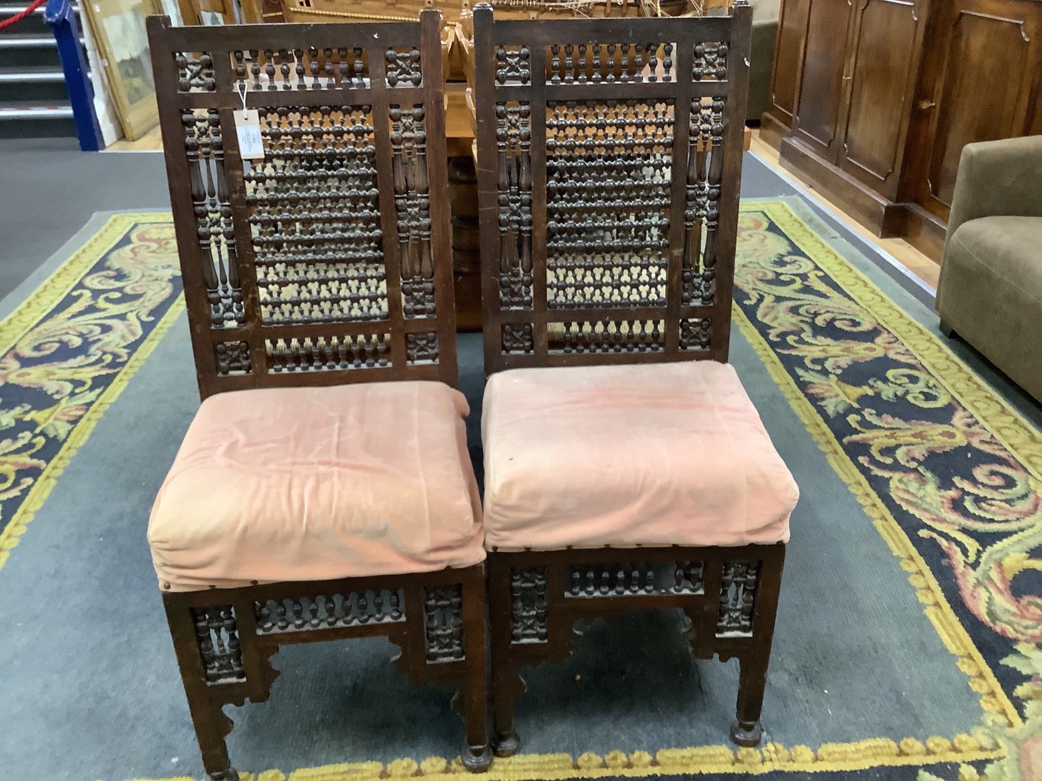 A pair of Liberty-style Moorish hardwood side chairs.